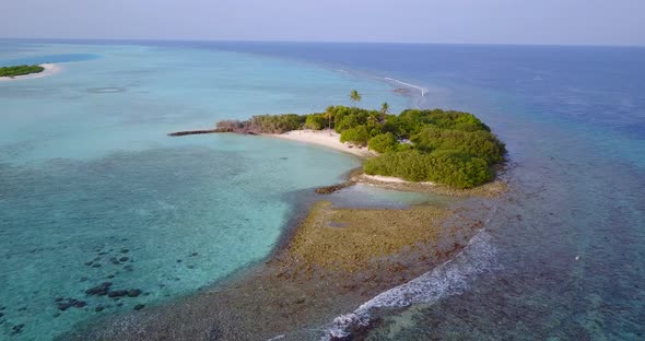 Wide birds eye abstract shot of a white paradise beach and blue sea background in colorful 4K