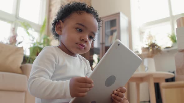 Close Up of Cute Toddler Boy with Tablet