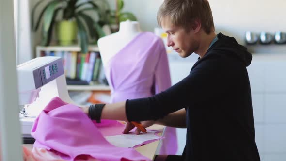 Fashion Designer with Cloth Making Dress at Studio