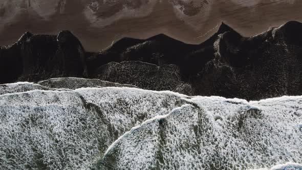 Overhead Shot Of Tide Coming In Over Beach