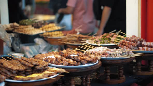 Traditional Asian Food Is Sold at The Night Market in Thailand