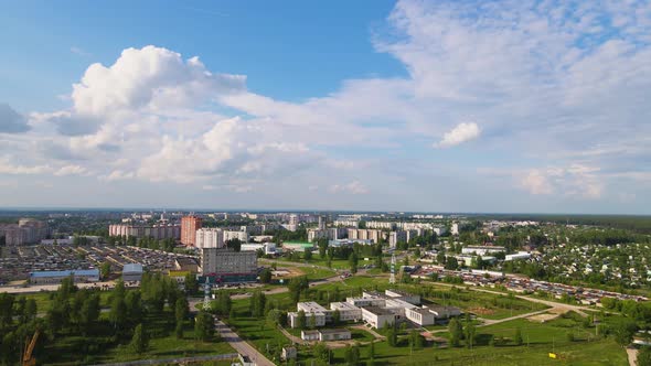 Highrise Buildings in Green Trees on the Outskirts of the City Aerial View