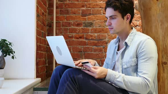 Man Excited for Successful Online Shopping Transaction of Money