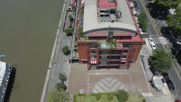 Drone Flying Above Waterfront Restaurants Along Rio Darsena Sur In Puerto Madero, Buenos Aires, Arge