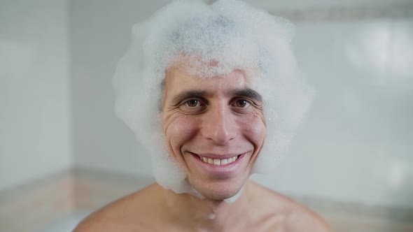 Smiling Man in a Foam Wig