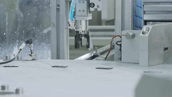 Advanced robotic machine manufacturing parts in an automated assembly line