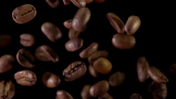 Coffee Beans Fly and Spin on a Black Background
