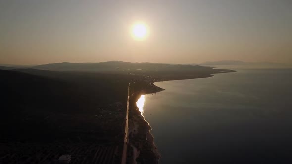 Aerial Scene of Shoreline and Green Upland at Sunset, Greece
