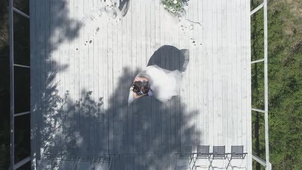 Top down aerial view of wedding couple spinning in a wedding pier 32