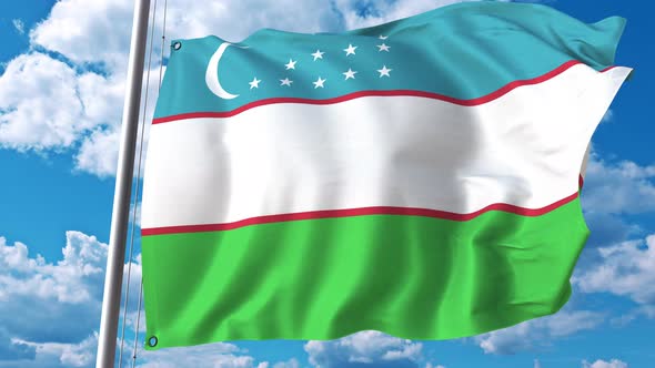 National Flag of Uzbekistan on Sky Background