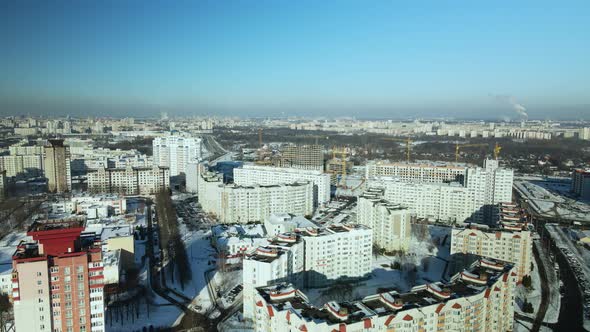 City quarters. Multi-story houses. Winter cityscape.