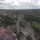 Fly over ruins of Sortelha hilltop castle, Portugal. National flag waving - VideoHive Item for Sale