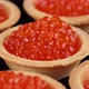 Tartlets with red caviar close-up, rotation. 4K UHD video - VideoHive Item for Sale