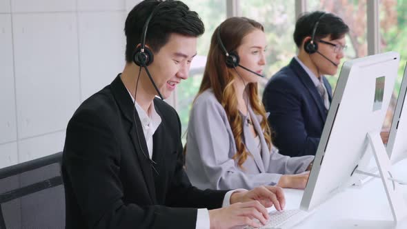 Business People Wearing Headset Working in Office