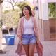 Stylish Ethnic Woman Walking Along Sidewalk of City - VideoHive Item for Sale