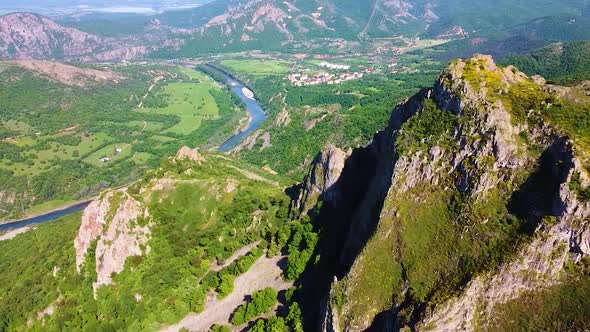 Flying by mountain with a view of a canyon river