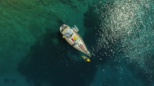 Aerial view of boat anchored on the coast of Varko, Greece.