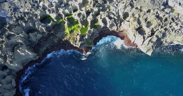 Aerial drone view of rocky tide pools coastline.