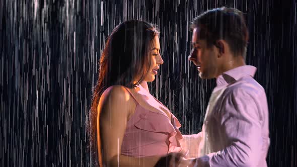 Love Story of Couple in Rain Expressed in Passionate Dance