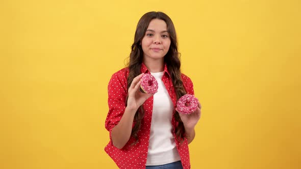 Happy Amazed Child Hold Donut on Yellow Background Childhood