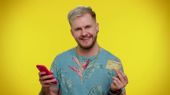 Tourist Man Using Credit Bank Card and Smartphone While Transferring Money Purchases Online Shopping