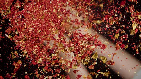 Pouring Spices on Glass on Black Background Using Seasoning and Flavors