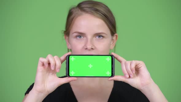 Young Happy Beautiful Businesswoman Showing Phone