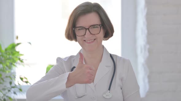 Senior Female Doctor Showing Thumbs Up Sign