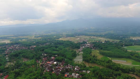 Grabag village and surrounding landscape, Indonesia. Aerial forward