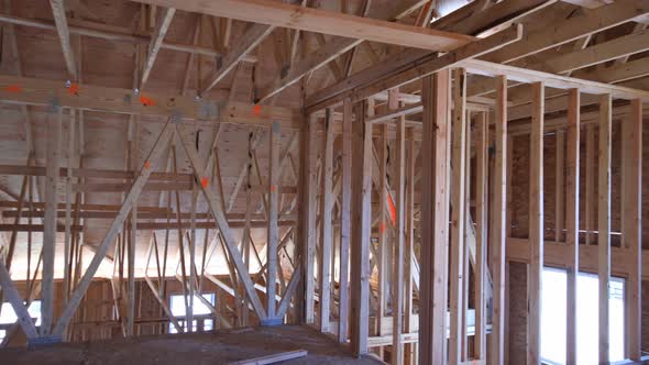 Unfinished Attic of Private House Residential Construction House Framing Agains