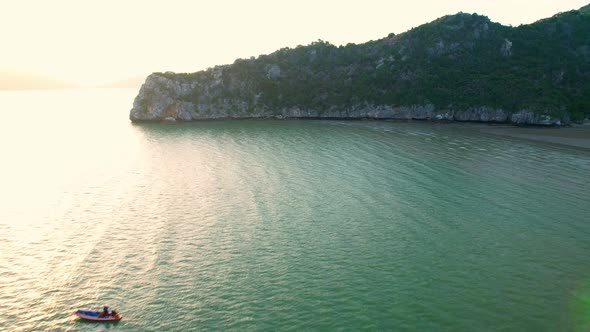 4K Aerial view of drone move on beautiful sea. sunset over ocean waves sand beach.