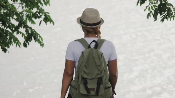 Woman with a backpack walking relax and refresh the air