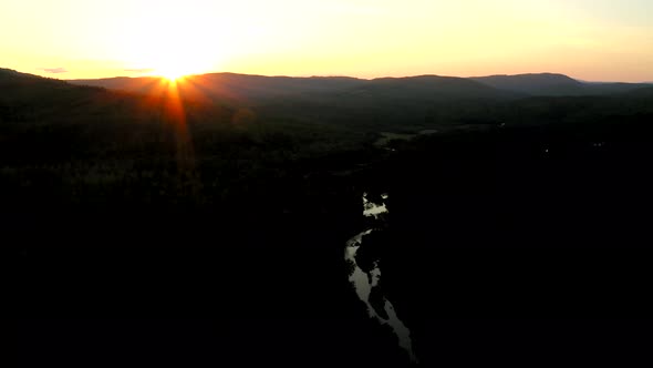 Aerial shot over Piscataquis River at Barrel Falls.