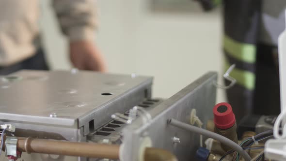 the repairman checks the gas stove