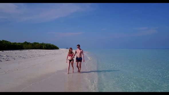 Man and lady sunbathe on tranquil resort beach time by turquoise ocean and white sand background of 