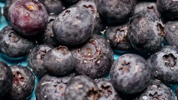 Top View of a Drop of Water on Fresh Blueberries