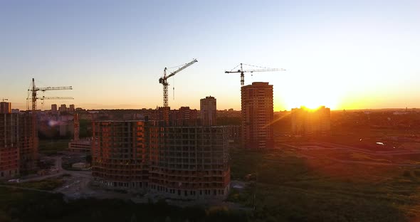 Aerial Drone View of Construction of a New Residential Complex at Sunset