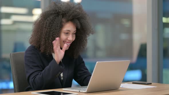 African Businesswoman Talking on Video Chat on Laptop