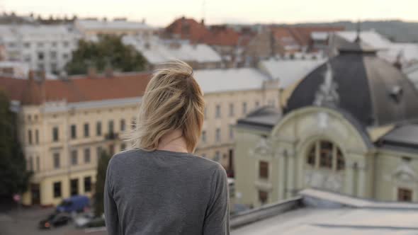 Woman walking on a roof