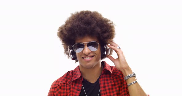 Beautiful Happy Fun Young Curly Black Hair Cool Adult Man Listening to Music Using Headphones and