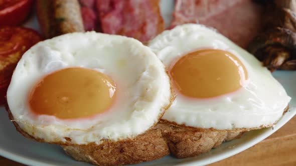 Closeup Fried Eggs on Toasts