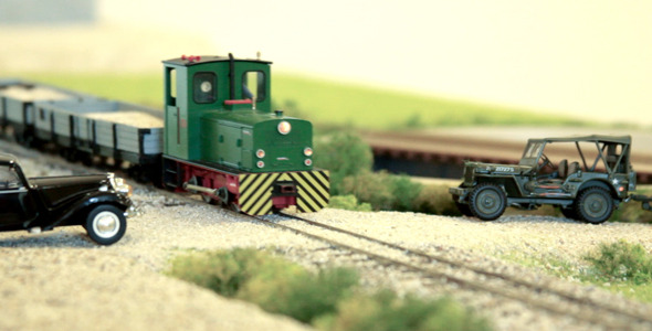 Model Train Passing By Cars