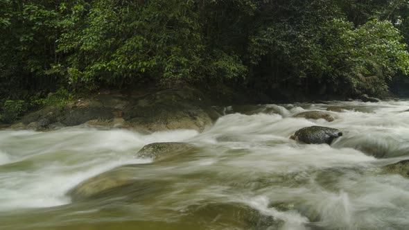 Timelapse panning shot of water fall over rock at Sungai Sedim, Kedah