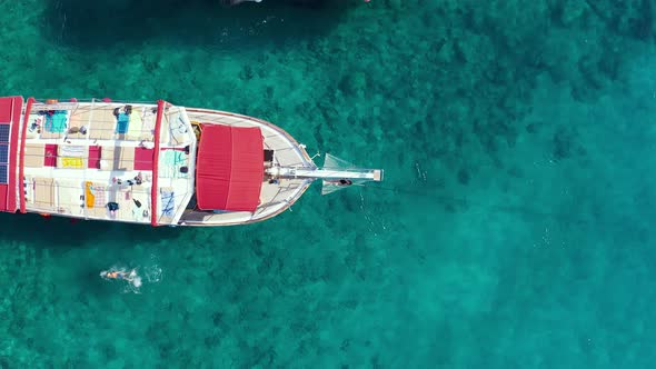 Girl in Bikkini Lies Hammock on the Bow of a Yacht Against the Backdrop of the Sea