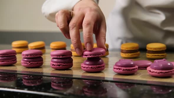 The Pastry Chef Assembles Macarons with Strawberry Cream