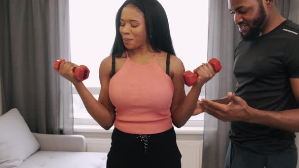 Couple of African Americans Doing Work Out at Home