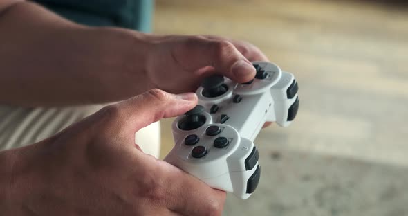 Close Up of Playing Video Games While Holding a Game Controller