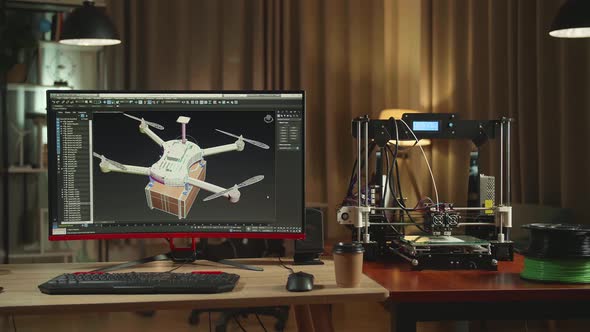 3D Printer And Personal Computer, Screen Shows Cad Software With 3D Prototype Of Drone Delivery