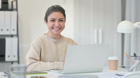 Indian Woman with Laptop Smiling at Camera 