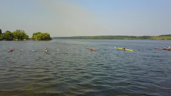 Training Athlete In Kayak. Training of small sportsmen rowers on a kayak on the river